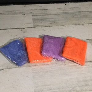 Set of four terry cloth looking wristband new in package two orange/blue/purple